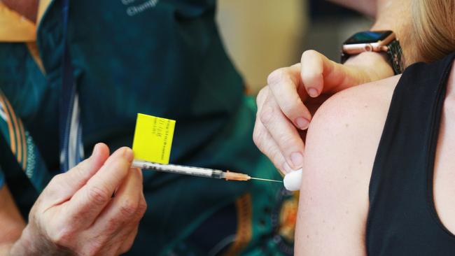 CHHHS clinical nurse Julie Brooker vaccinates Tammy Allen of Redlynch Valley with the Pfizer Covid-19 vaccine. Picture: Brendan Radke