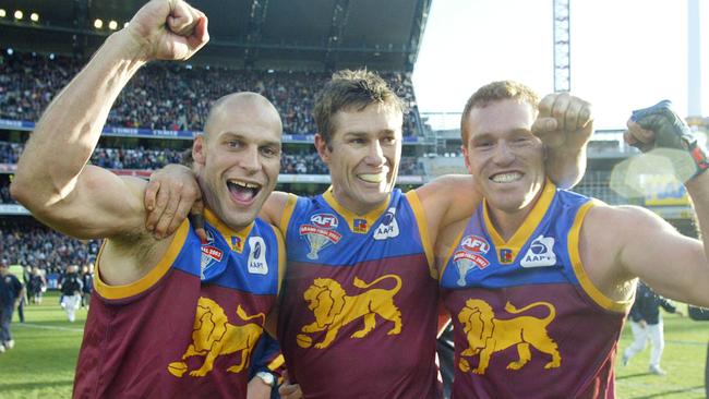 Pike with premiership teammates Alastair Lynch and Justin Leppitsch.