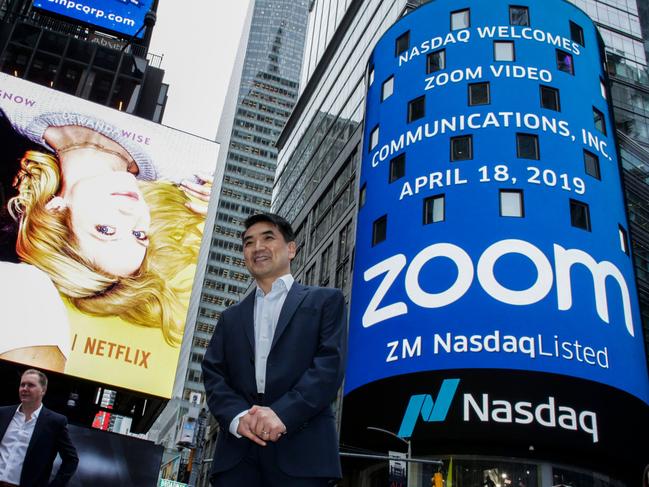 (FILES) In this file photo Zoom founder Eric Yuan poses in front of the Nasdaq building as the screen shows the logo of the video-conferencing software company Zoom after the opening bell ceremony on April 18, 2019 in New York City. - Zoom shares soared on August 31 after the video-meeting service reported that quarterly revenue rocketed as its ranks of users more than quadrupled. (Photo by KENA BETANCUR / GETTY IMAGES NORTH AMERICA / AFP)