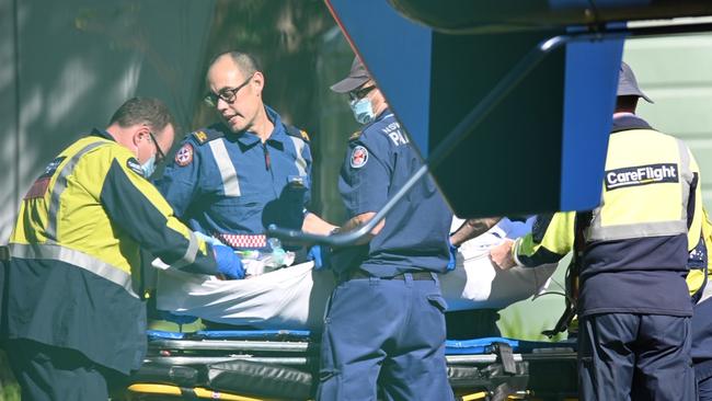 Paramedics treat a 9-year-old boy after an accident at Mona Vale Public school. Picture: Seb Dekker.