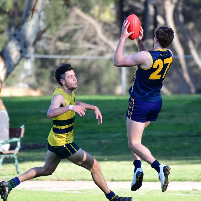 Action from the round one college footy clash between Scotch and Pembroke. Picture: Leo Panzarino