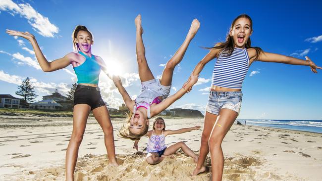 Kaylana Biggs, Courtney Sutherland and Poppy Watkin love the warm weather the Gold Coast has to offer. Picture: Nigel Hallett.