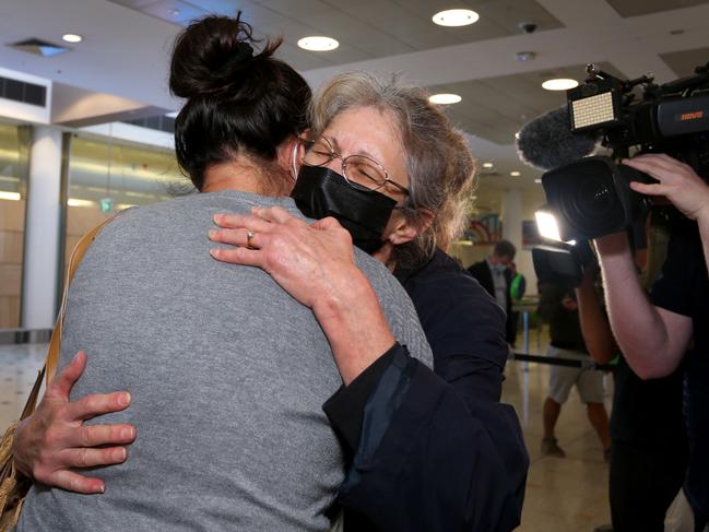 A mother and daughter are reunited at Sydney’s International Airport as early morning flights arrive from Los Angeles, Japan and Singapore. Picture: Getty Images