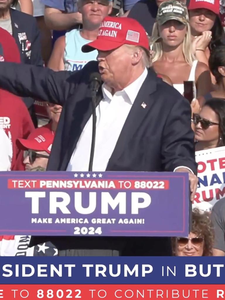 Donald Trump onstage seconds before shooting. Picture: Getty