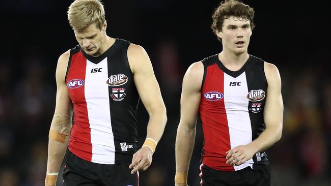 Nick Riewoldt and Blake Acres leave Etihad Stadium after losing to Sydney.