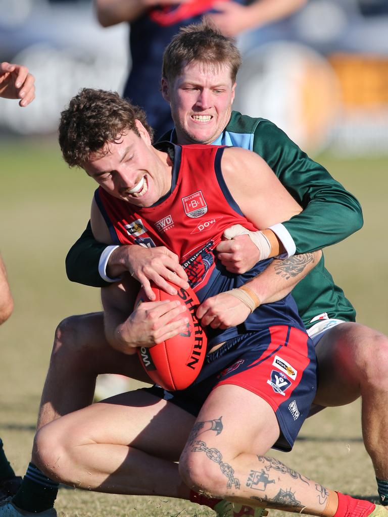 BFNL - Portarlington v Geelong Amateurs. Port's Max Ruiter caught by Ammos Harrison Orr.  Picture Mike Dugdale