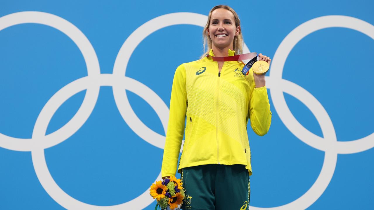 TOKYO, JAPAN - JULY 30: Gold medalist Emma McKeon of Team Australia celebrates on the podium during the medal ceremony for the Women's 100m Freestyle Final on day seven of the Tokyo 2020 Olympic Games at Tokyo Aquatics Centre on July 30, 2021 in Tokyo, Japan. (Photo by Maddie Meyer/Getty Images)