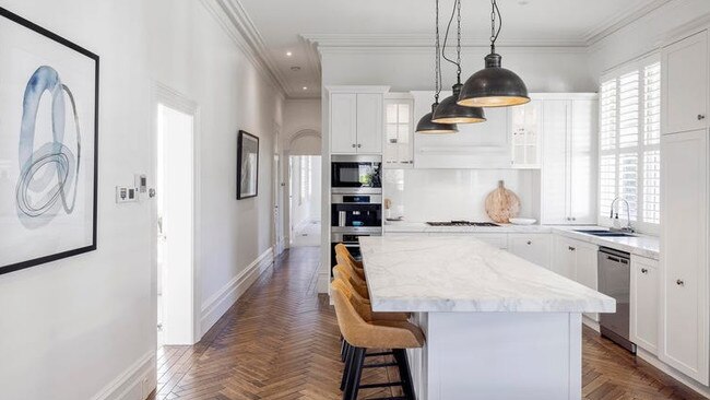 Marble benches add glamour to the kitchen.