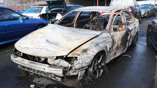 The burnt out Holden Commodore believed to be connected to the shooting. Picture: NIKKI DAVIS-JONES