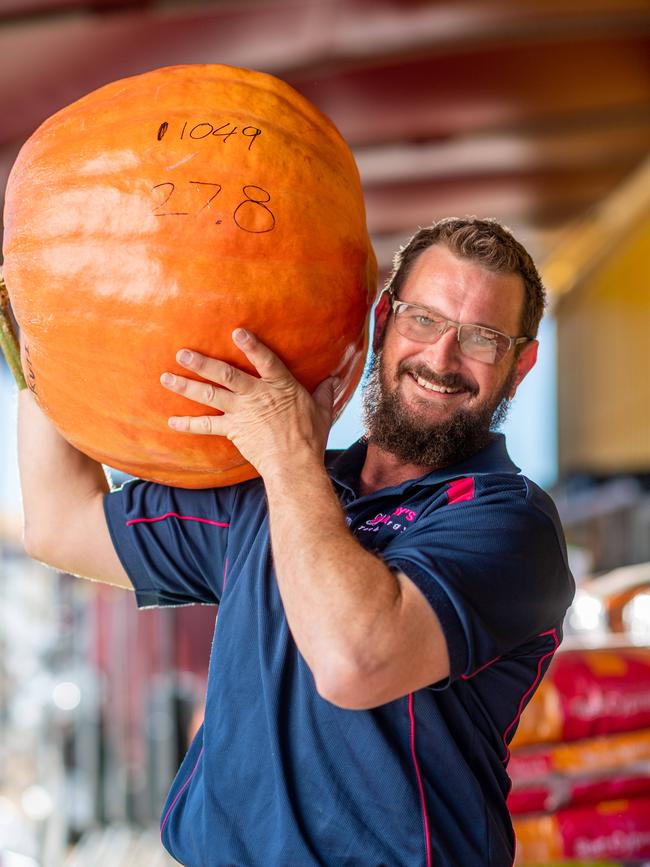 Chris Rutishauser enters his 27.8kg pumpkin in the annual pumpkin growing competition for the Royal Darwin Show. Picture: Che Chorley