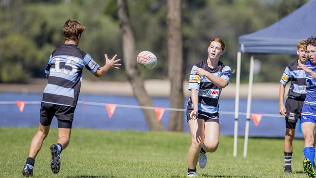 Day One of King of the Country rugby tournament at James Overell Park, Southport. Maroochydore Swans U14s' ( big stripes - blue) in action against USQ Saints U14s' (darker blue small stripes). Maroochydore Swans U14s Tilly Cason . Picture: Jerad Williams