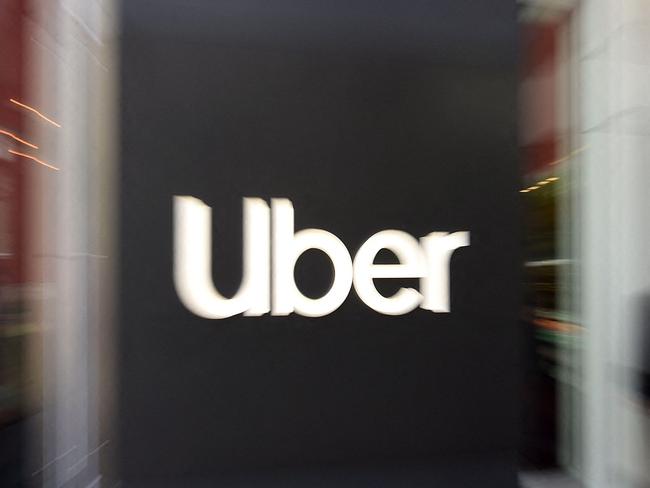 (FILES) In this file pan zoom photo taken on May 08, 2019 an Uber logo is seen outside the company's headquarters in San Francisco, California. - Uber on April 28, 2021 added valet delivery of rental cars as part of a suite of offerings as it aims to be "one-stop-shop" for post-pandemic venturing out or dining in. As Covid-19 vaccines make it safer for people to move about, Uber aims to be a hub for summoning rides; running errands, or renting vehicles. (Photo by Josh Edelson / AFP)