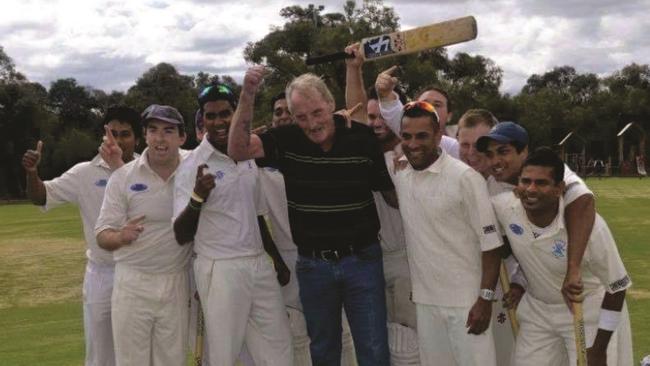 Daryl Taylor celebrates with Lyndale’s 2013-2013 Turf 2 premiership team. Pic: Rodney Keyaerts