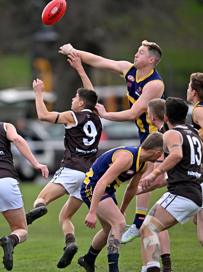 EDFL: Rupertswood’s Brodie Griffiths puts a big fist on the ball. Picture: Andy Brownbill