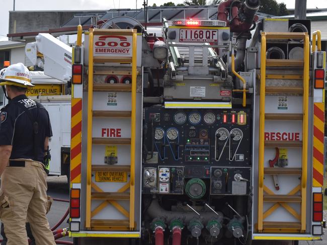 Woman in hospital after house fire, caravan erupts in flames