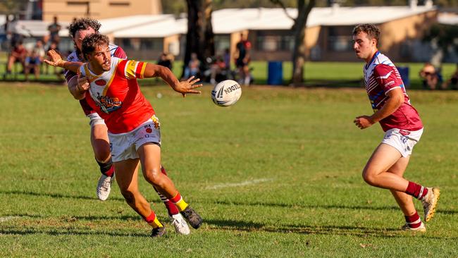 Ronan Singleton offloading the ball. Picture: D Wigley
