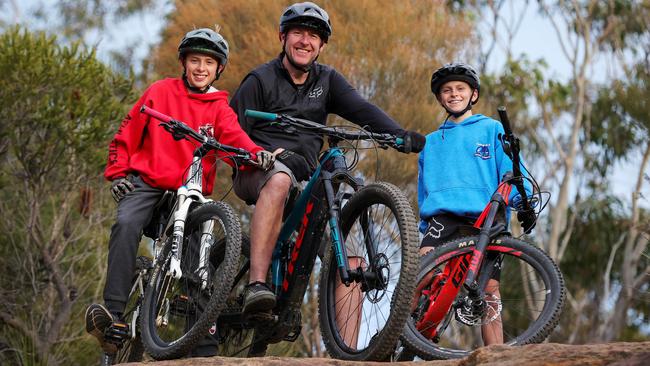 Harry, James and Thomas Woods mountain biking in Belrose. Picture: Justin Lloyd