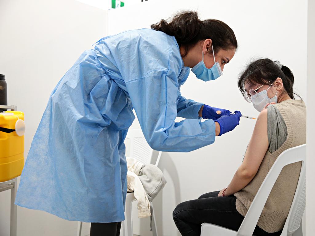 Nan Hu, 27 (right) getting her first dose of Covid-19 vaccine at the Roseville vaccination clinic on the Pacific Hwy. Picture: NCA NewsWire/Adam Yip