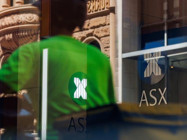 SYDNEY, AUSTRALIA - NewsWire Photos, October 29 2024. GENERIC. Stocks. Finance. Economy. A food delivery rider passes the Australian Stock Exchange, ASX, on Bridge Street. Picture: NewsWire / Max Mason-Hubers