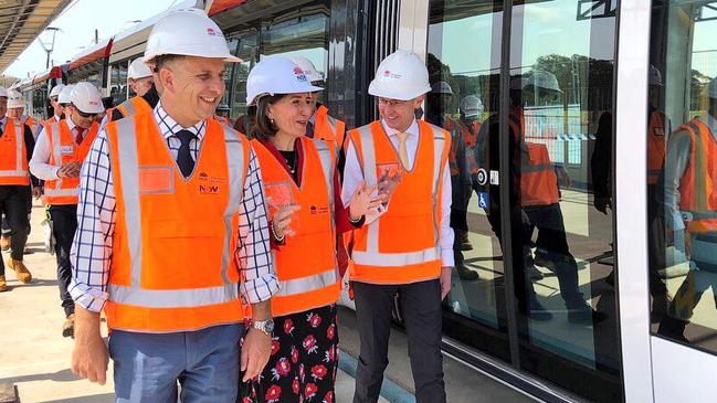 Mr Constance (left) and Premier Gladys Berejiklianprepare to take a test ride on the light rail in Randwick.