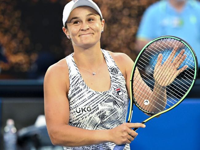 Ashleigh Barty of Australia reacts after winning her first Round Women's singles match against Lesia Tsurenko of Ukraine on Day 1 of the Australian Open, at Melbourne Park, in Melbourne, Monday, January 17, 2022. (AAP Image/Dave Hunt) NO ARCHIVING