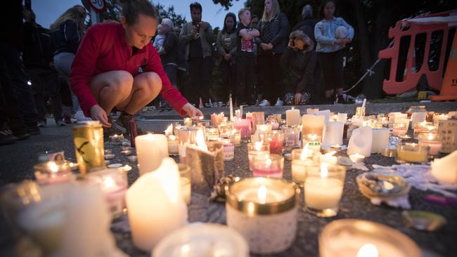 Candles are placed to commemorate victims of Friday's shooting, outside the Al Noor mosque. Picture: AP 