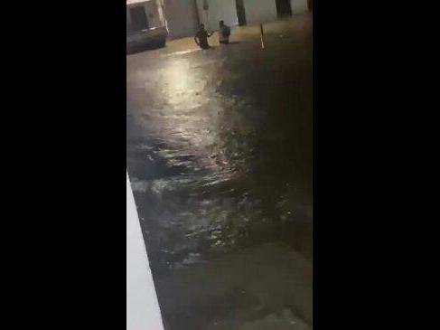 Locals Wade Through Floodwater in South Guatemala City