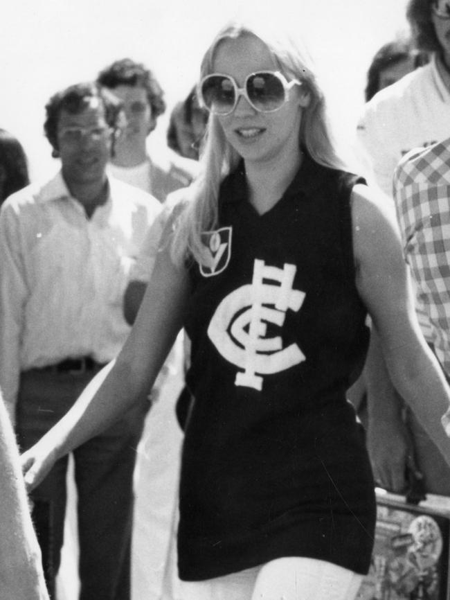 Agnetha Faltskog wears a Carlton Football Club jumper on Abba's arrival at Adelaide Airport.