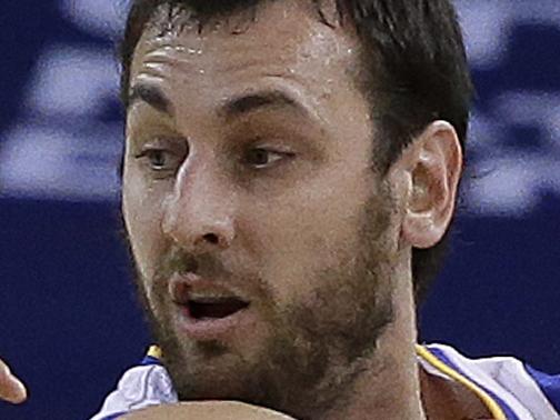 Golden State Warriors' Andrew Bogut, right, keeps the ball from Orlando Magic guard Evan Fournier (10) during the first half of an NBA basketball game Tuesday, Dec. 2, 2014, in Oakland, Calif. (AP Photo/Ben Margot)