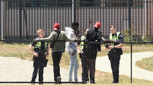 Police talk to African youths outside Ecoville Community Park in Tarneit.