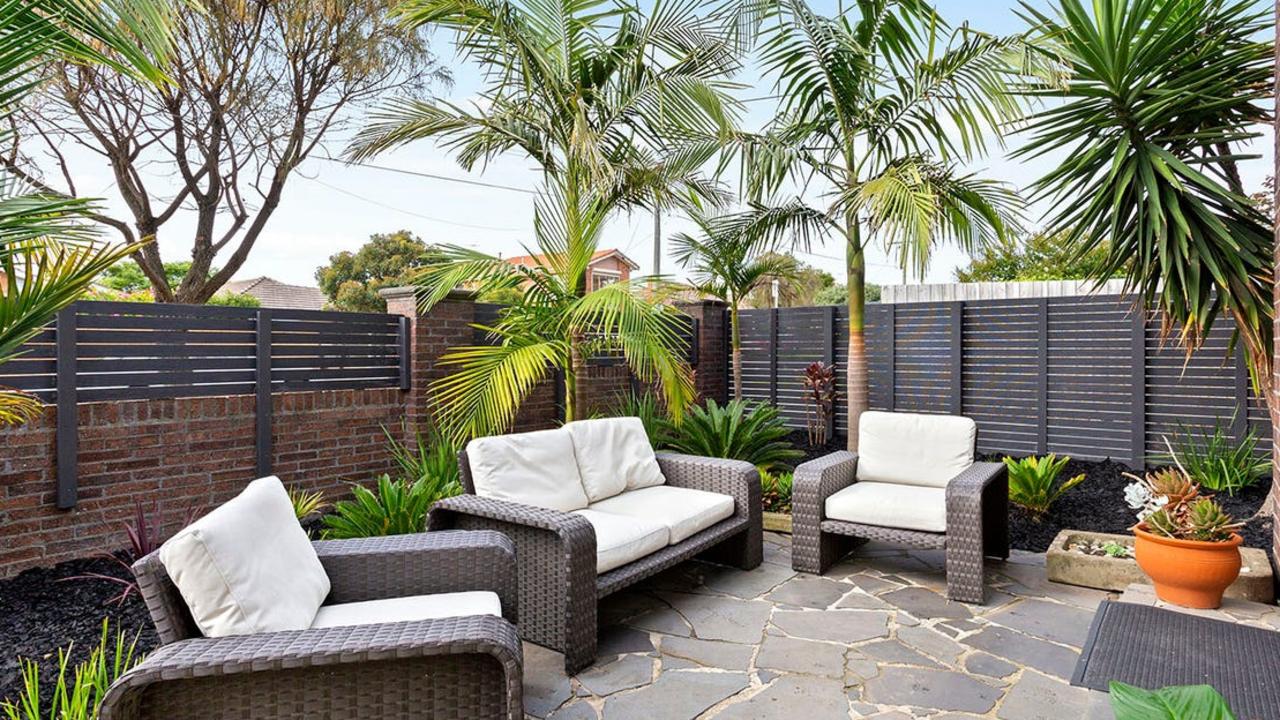 A second outdoor living area at the front of the home.