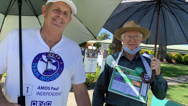 Dean Crockett supports Paul Amos and Brian Maherny was at the polling booth at the Coffs Harbour showground in support of Greens candidate Jonathan Cassell. Picture: Janine Watson