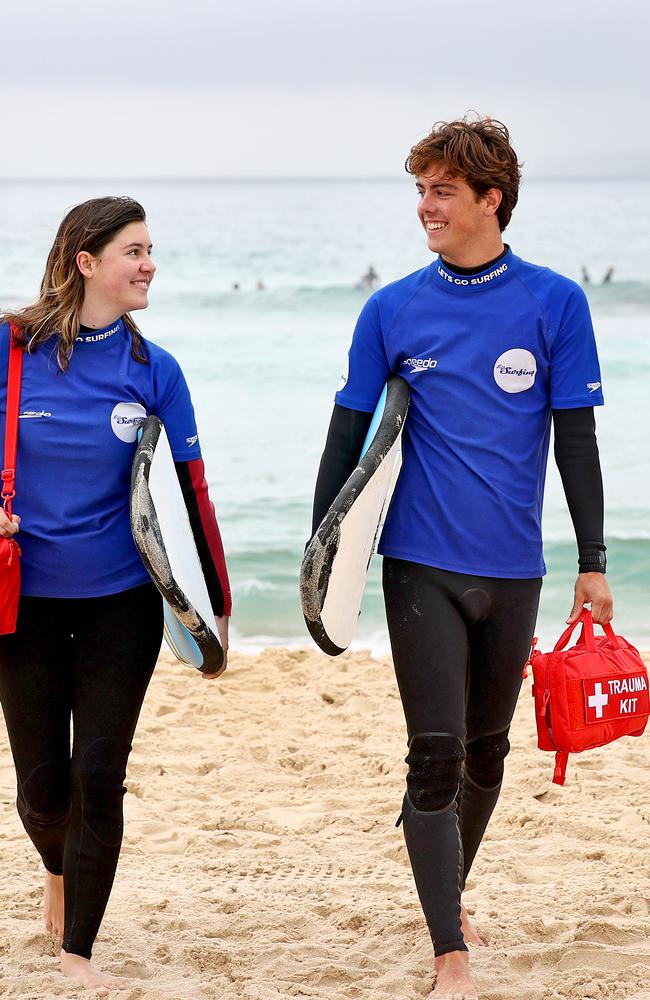 Surfers Eliza Wachholz 18 and Max Leedham 17 pictured at Bondi Beach with the new kit. Picture: Toby Zerna