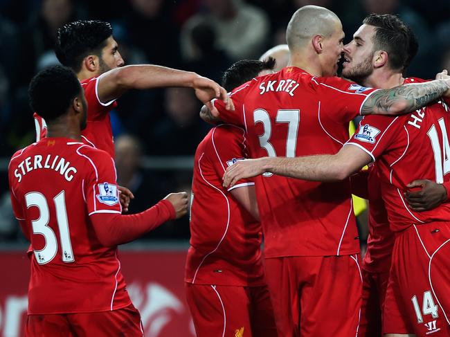 SWANSEA, WALES - MARCH 16: Jordan Henderson of Liverpool celebrates the opening goal with team mates during the Barclays Premier League match between Swansea City and Liverpool at Liberty Stadium on March 16, 2015 in Swansea, Wales. (Photo by Mike Hewitt/Getty Images)