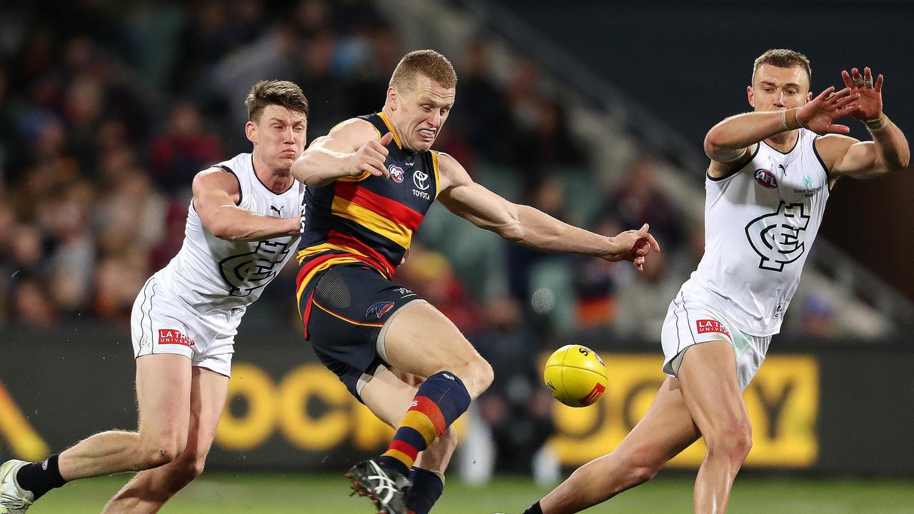 Sam Walsh and Patrick Cripps can’t stop Reilly O’Brien. Picture: Sarah Reed/AFL Photos via Getty Images