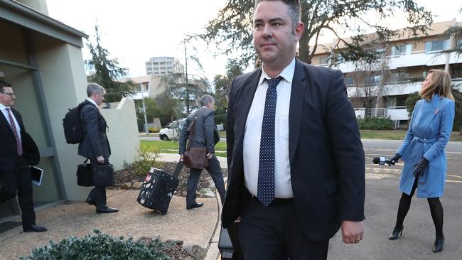 Federal police officers leaving the home of News Corp Sunday National Political Editor Annika Smethurst on Tuesday.