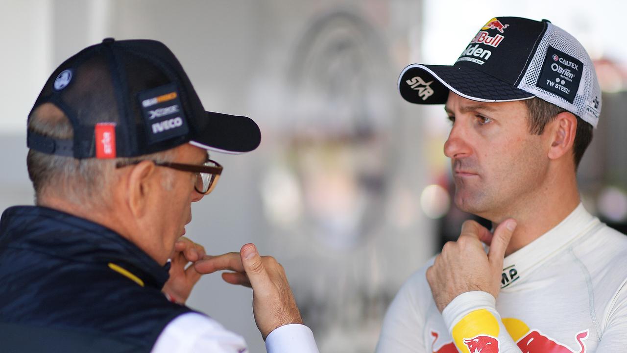 (L-R) Roland Dane talks with Jamie Whincup.