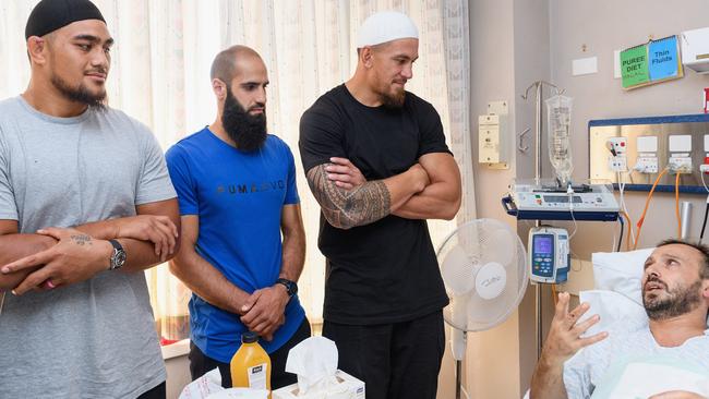 All Blacks rugby stars Ofa Tu'ungafasi, Sonny Bill Williams and Bachar Houli (middle) meet Temel Atacocugu, a survivor of the shootings at Al Noor mosque, during a visit to Christchurch Hospital in March. Picture: Getty