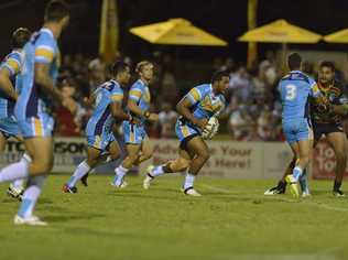 Titans player Kalifa Faifai Loa on the attack in their NRL pre-season trial against New Zealand Warriors at Clive Berghofer Stadium, Saturday, February 7, 2015. Photo Kevin Farmer / The Chronicle. Picture: Kevin Farmer