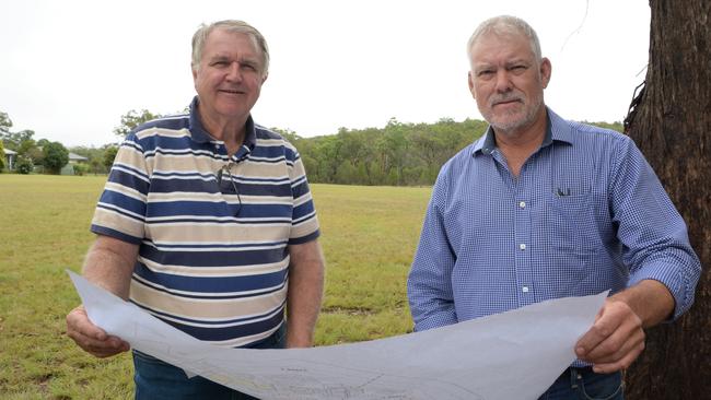 Crows Nest Community Solutions Ltd directors Jeff Close and Baden Brown surveys the plans for a new community and affordable housing project at the end of Creek Street in Crows Nest, dubbed Chaseley Park.