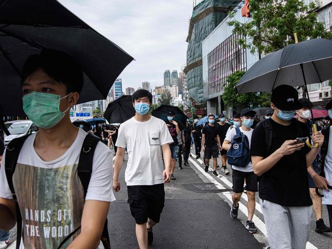 Protesters walk in a road as they attend a pro-democracy rally against a proposed new security law in Hong Kong. Picture: AFP