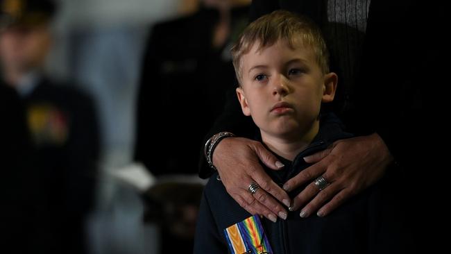 Theo Baxter is seen wearing his great-grandfather’s service medals during the Anzac Day Dawn Service at The Cenotaph in Sydney. Picture: NCA NewsWire/Bianca De Marchi