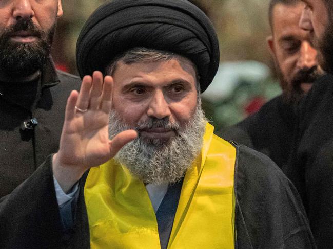 (FILES) Senior Hezbollah official Hashem Safieddine (C) attends the funeral ceremony of slain top commander Fuad Shukr in Beirut's southern suburbs on August 1, 2024. A high-level Hezbollah source said on October 5, 2024 that contact with Hashem Safieddine, widely touted as potentially the group's next leader, had been lost following Israeli strikes this week. (Photo by Khaled DESOUKI / AFP)