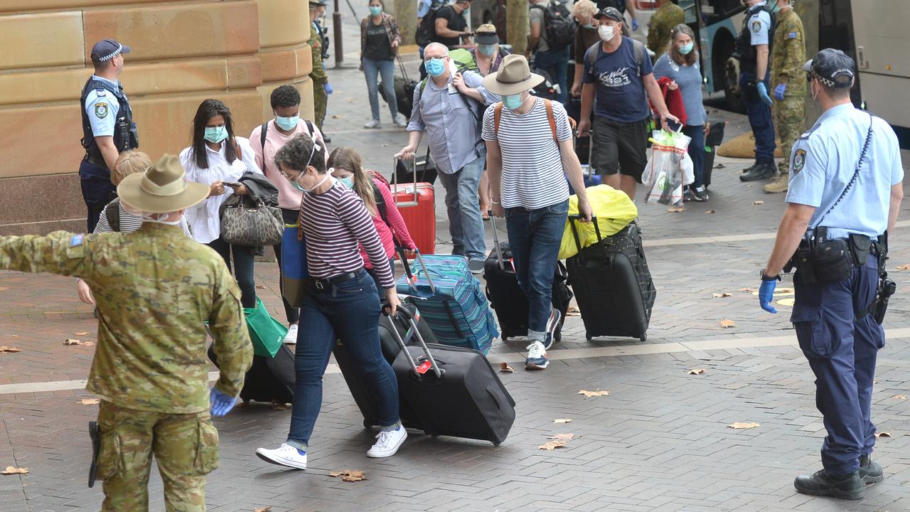 Australia was quick to impose hotel quarantine. Here, overseas travellers are ushered into the InterContinental Hotel in Sydney on March 29. Picture: Jeremy Piper/AAP