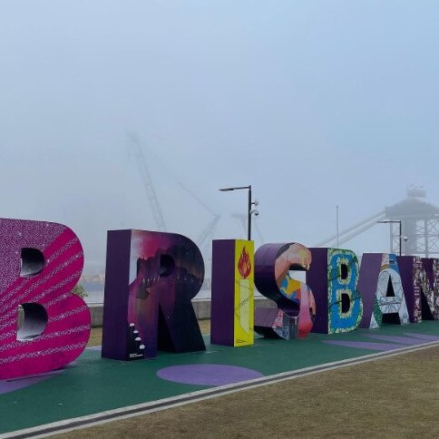 The CBD, which usually towers behind the Brisbane sign at South Bank, was completely hidden. Picture: Brian Hurst.