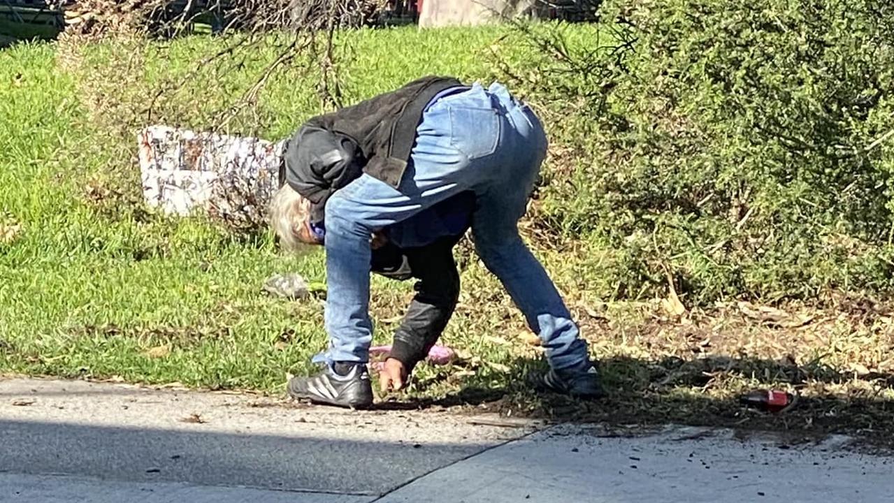 An apparently drug-affected man seen near the facility digging in the grass. Picture: Facebook