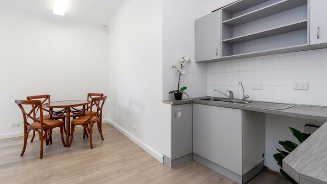 A kitchenette with storage space.