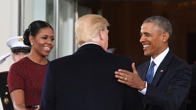 Donald Trumpis greeted by US President Barack Obama and First Lady Michelle Obama as he arrives at the White House in Washington, DC January 20, 2017.