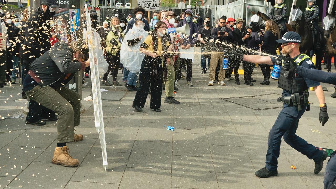 Protesters as well as media were directly and indirectly hit with pepper spray. Picture: NewsWire / Luis Enrique Ascui