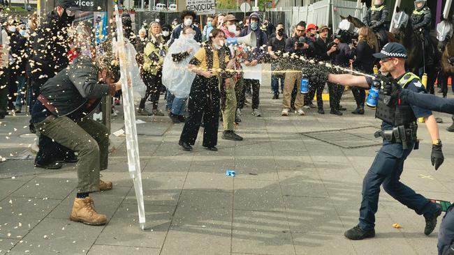 Protesters as well as media were directly and indirectly hit with pepper spray. Picture: NewsWire / Luis Enrique Ascui